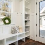 Storage Home - gray and white floral throw pillow beside rack inside room