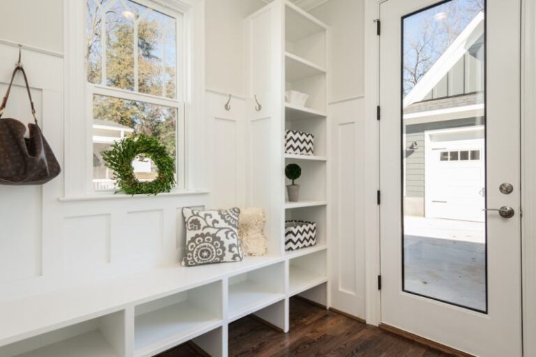 Storage Home - gray and white floral throw pillow beside rack inside room