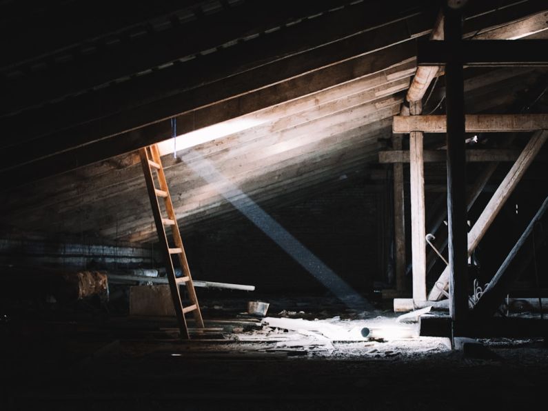 Attic - brown wooden ladder on brown wooden wall