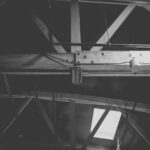 Attic Home - a black and white photo of a metal beam