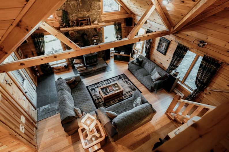 Attic Home - a living room with a wood ceiling