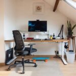 Attic Home - a desk with a computer on top of it