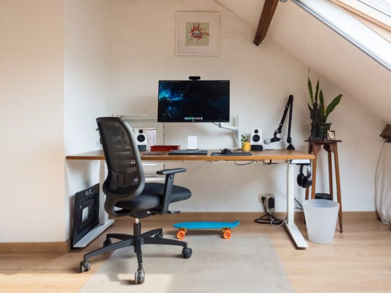 Attic Home - a desk with a computer on top of it