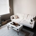 Attic Home - white couch in front of white wooden table