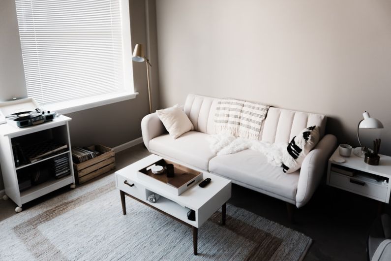 Attic Home - white couch in front of white wooden table