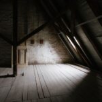 Attic Window - a wooden walkway with a light at the end