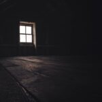 Attic Window - a dark room with a window and a wooden floor