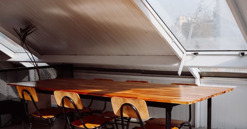 Attic Window - A Table and Chairs in an Attic