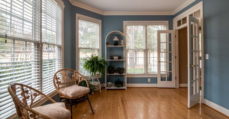 Fans Home - Photo Of Wooden Chair Near Window