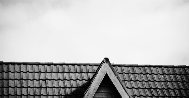 Attic Window - View of a Roof and Attic Window of an Old House