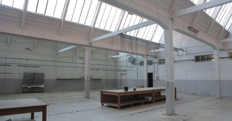 Ceiling Support - Bright premise for storage with concrete floor and metal beams inside modern industrial building