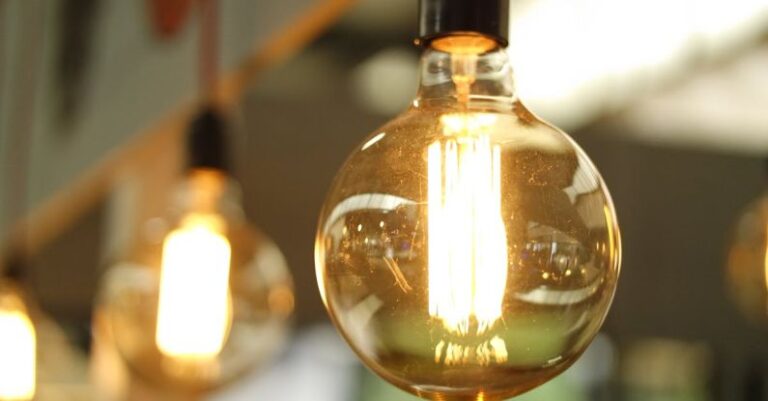 Energy Efficiency - Lighted Light Bulb in Selective-focus Photography