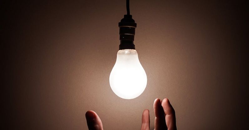 Electrical Compliance - Person Holding White Light Bulb