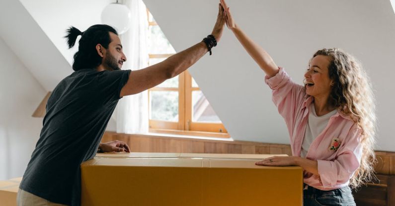 Attic Bedroom - Exited diverse couple relocating in new apartment