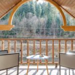 Attic Zones - Wooden Balcony on Attic with Steel Framed Chairs