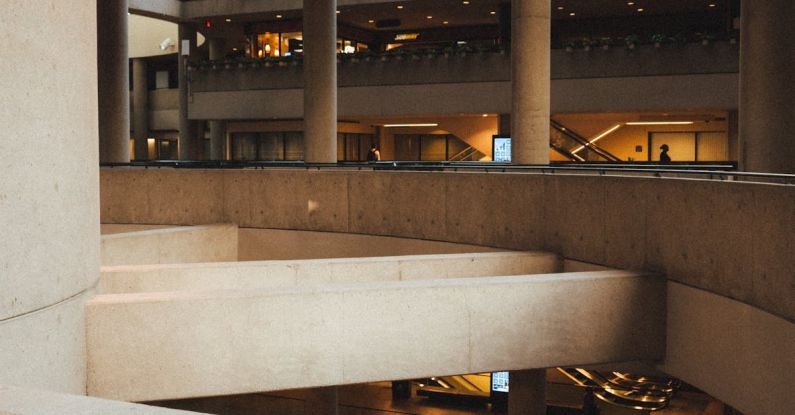 Track Expenses - Contemporary building interior with columns and glass ceiling