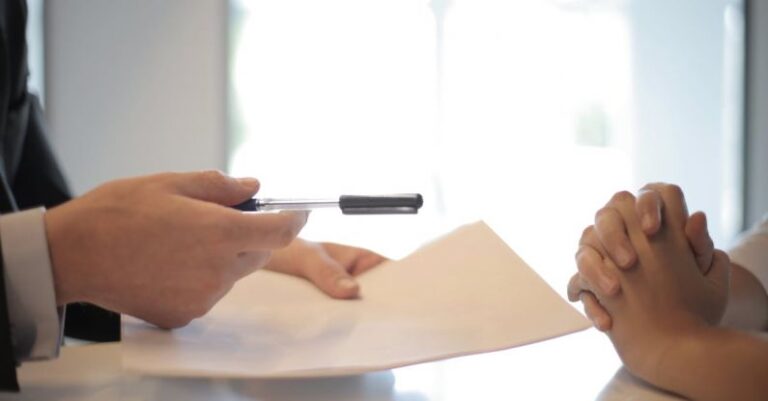 Licensing And Insurance - Crop businessman giving contract to woman to sign