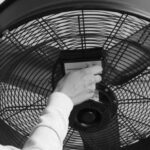 Ventilation Fan - Grayscale Photo of Person Turning on an Industrial Fan