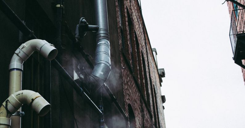 Soffit Vents - Gray Pipe on Building Wall