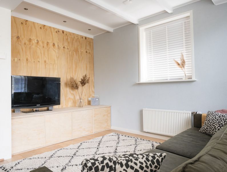 Underlayment - black flat screen tv on brown wooden tv rack