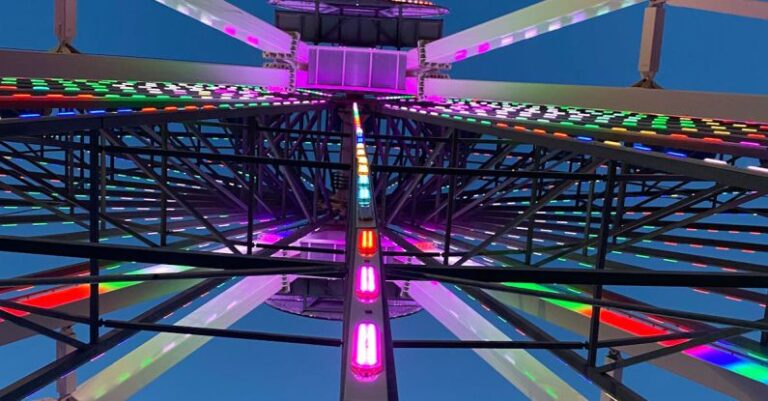 LED Lighting - A ferris wheel with colorful lights at night